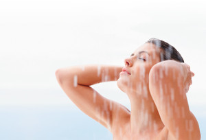 An image of a woman in the shower with continuous hot water